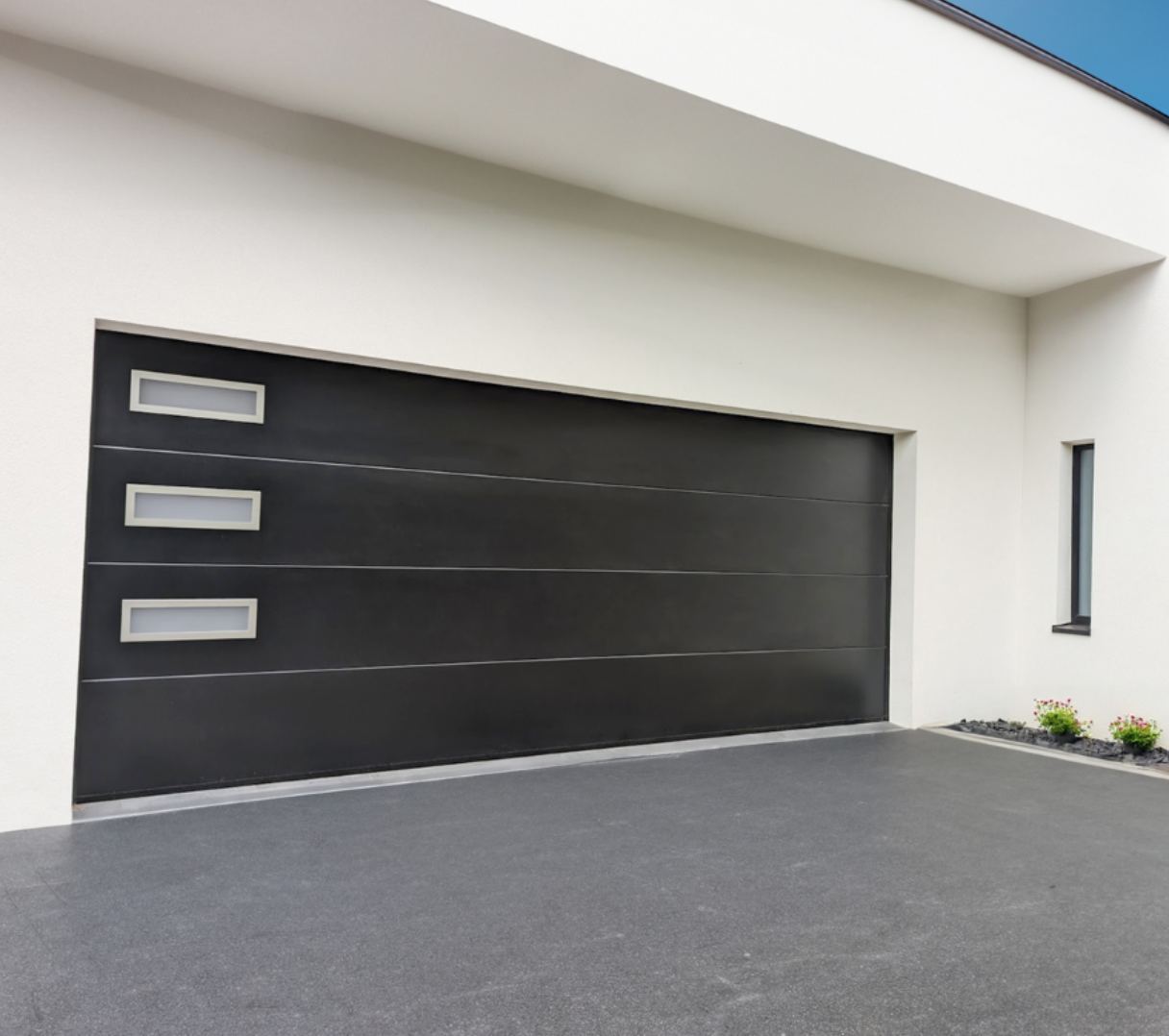 Porte de garage sectionnelle installée par PRO-SERVICE